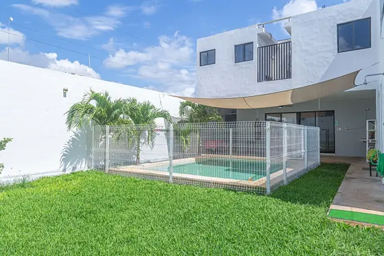 Lawn and the fenced pool